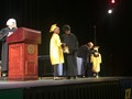A student receives a diploma during Gearity's mock college graduation ceremony.