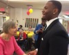 Junior Jayson Perry dances with a resident.