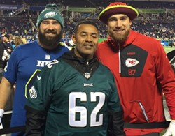 Travis Kelce (L) with his former coach Mike Jones