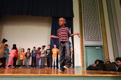 Rox El male student jumping rope on stage