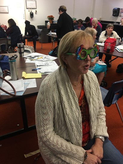 Nurse with glasses taking a vision test