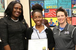 Yidiayah Box (center) was honored at a Board of Education meeting in September.