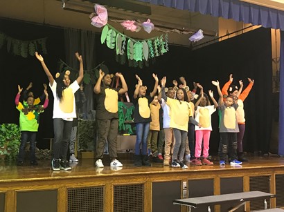 Students on stage performing Jungle Book