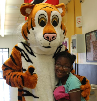 student with tiger mascot