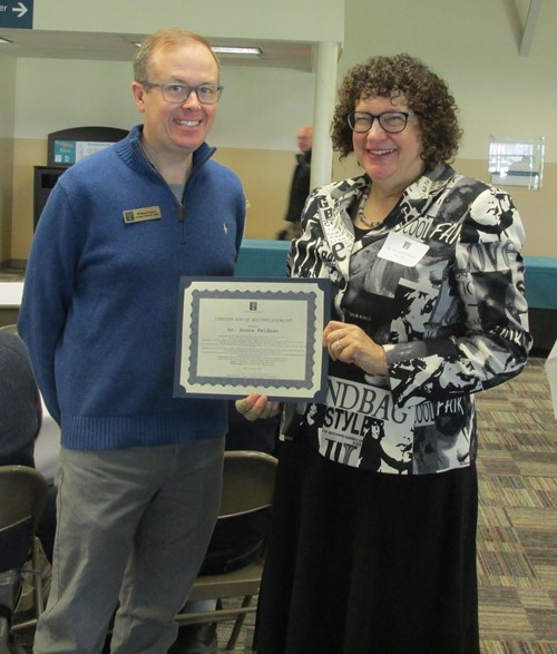 Dr. Donna Feldman with associate dean and award