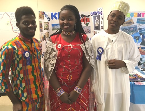 Emmanuel Saah, Mercy, Sakayian and Swalehe Mbagga with their presentations and traditional clothes at the April 28 AFS Gala