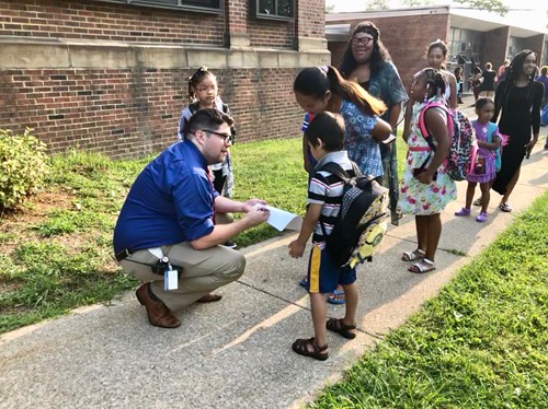 Principal talking to kids outside