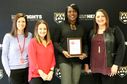 Dr. Dixon with several other women and plaque