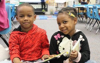 two children with books