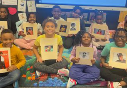 students smiling with pictures
