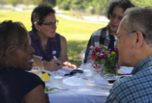 people at table talking