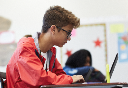 student at laptop computer