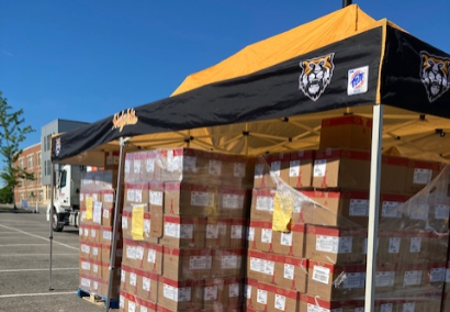 tent with produce boxes underneath