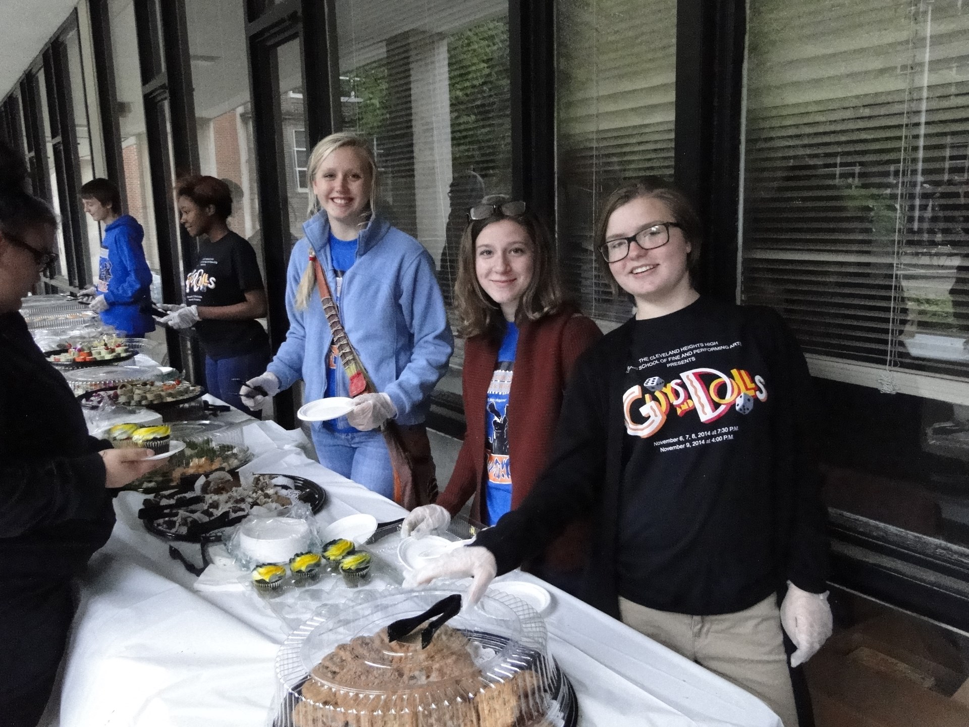 Students helping serve food during the event