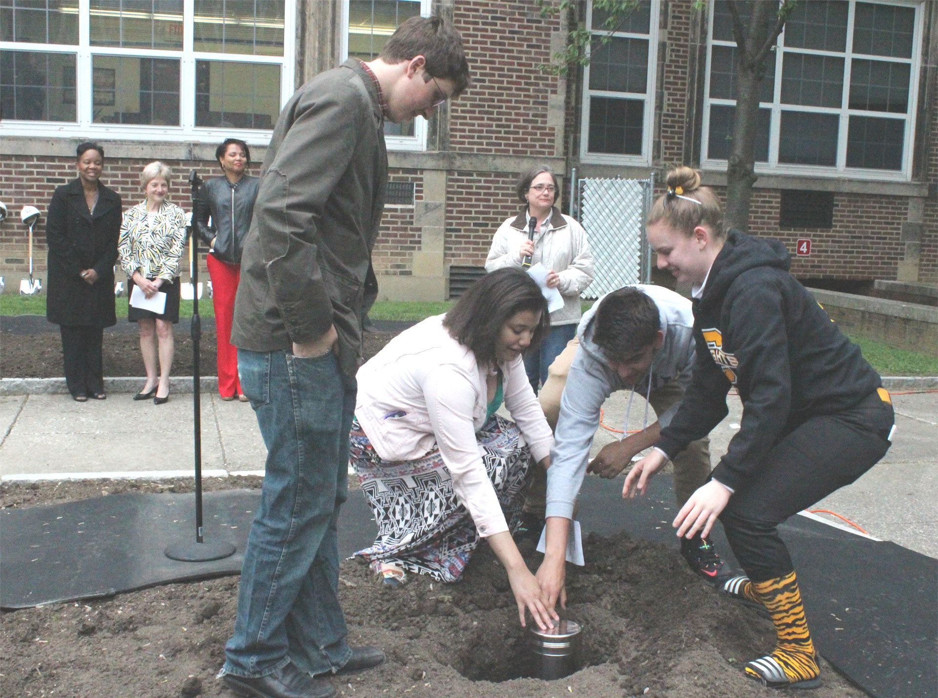 Small Schools ambassadors place time capsule in the ground