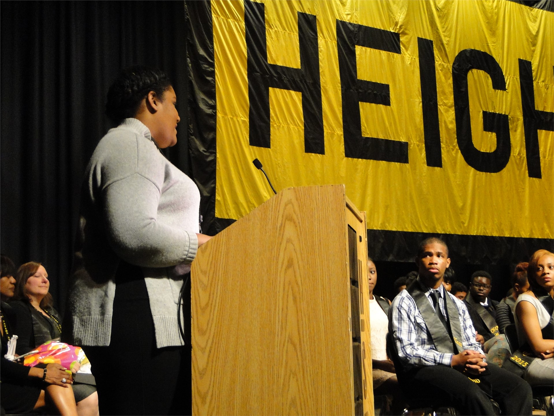 A junior AVID student addresses the senior class 