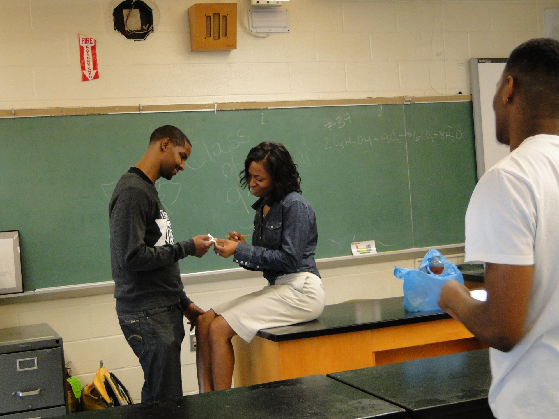 Roosevelt and Laeh reenacting the moment when he asked for her phone number in science class.