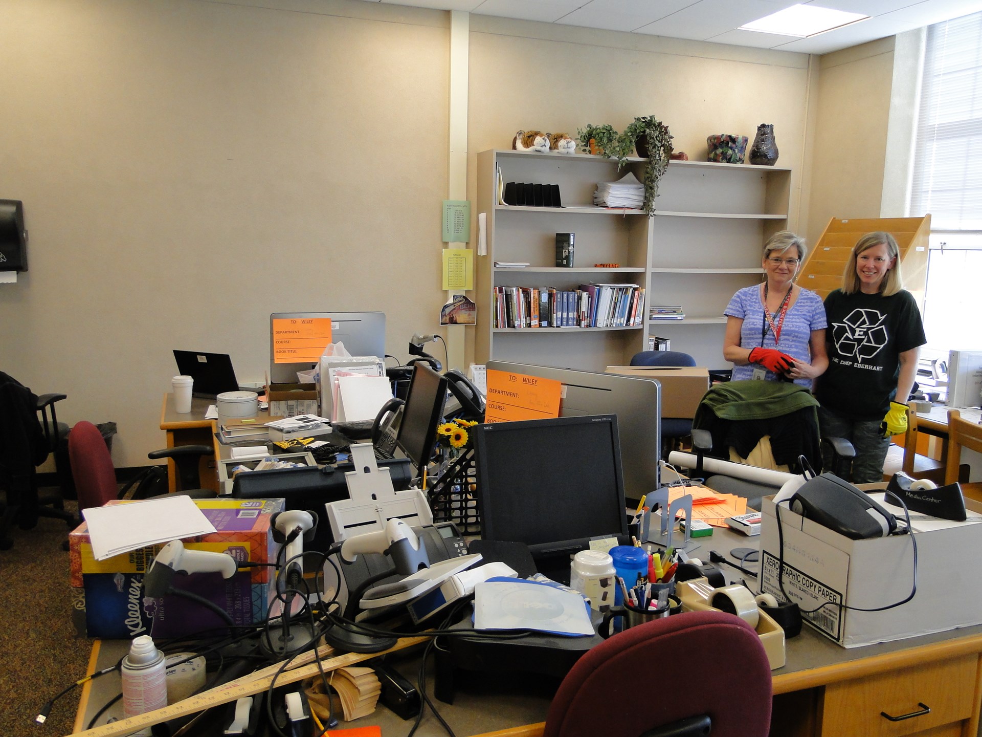 Librarians Kathy Lawrence and Amy Bloomberg (L-R) pack their office and so much more.