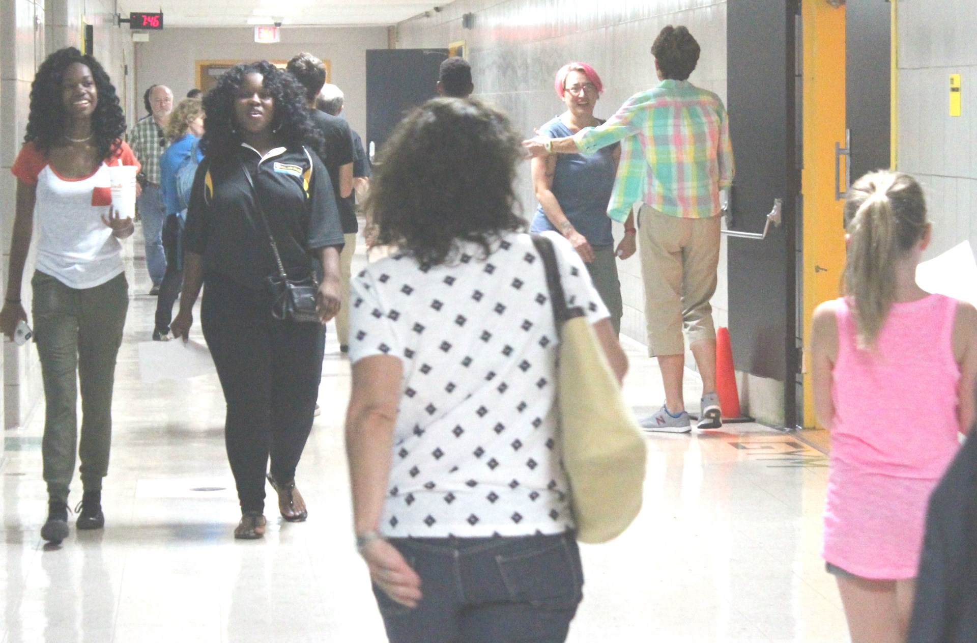 Parents and students head to class.