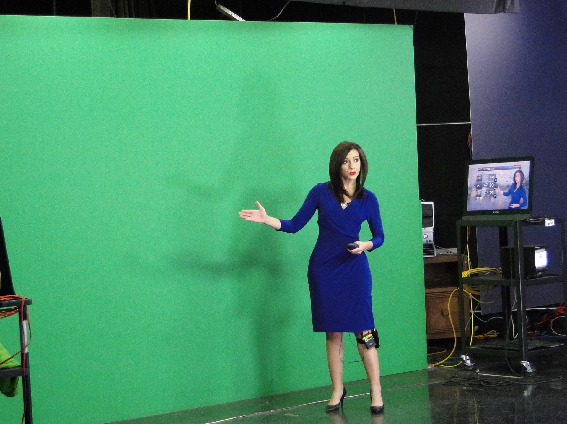 Meteorologist Samantha Roberts at green screen.