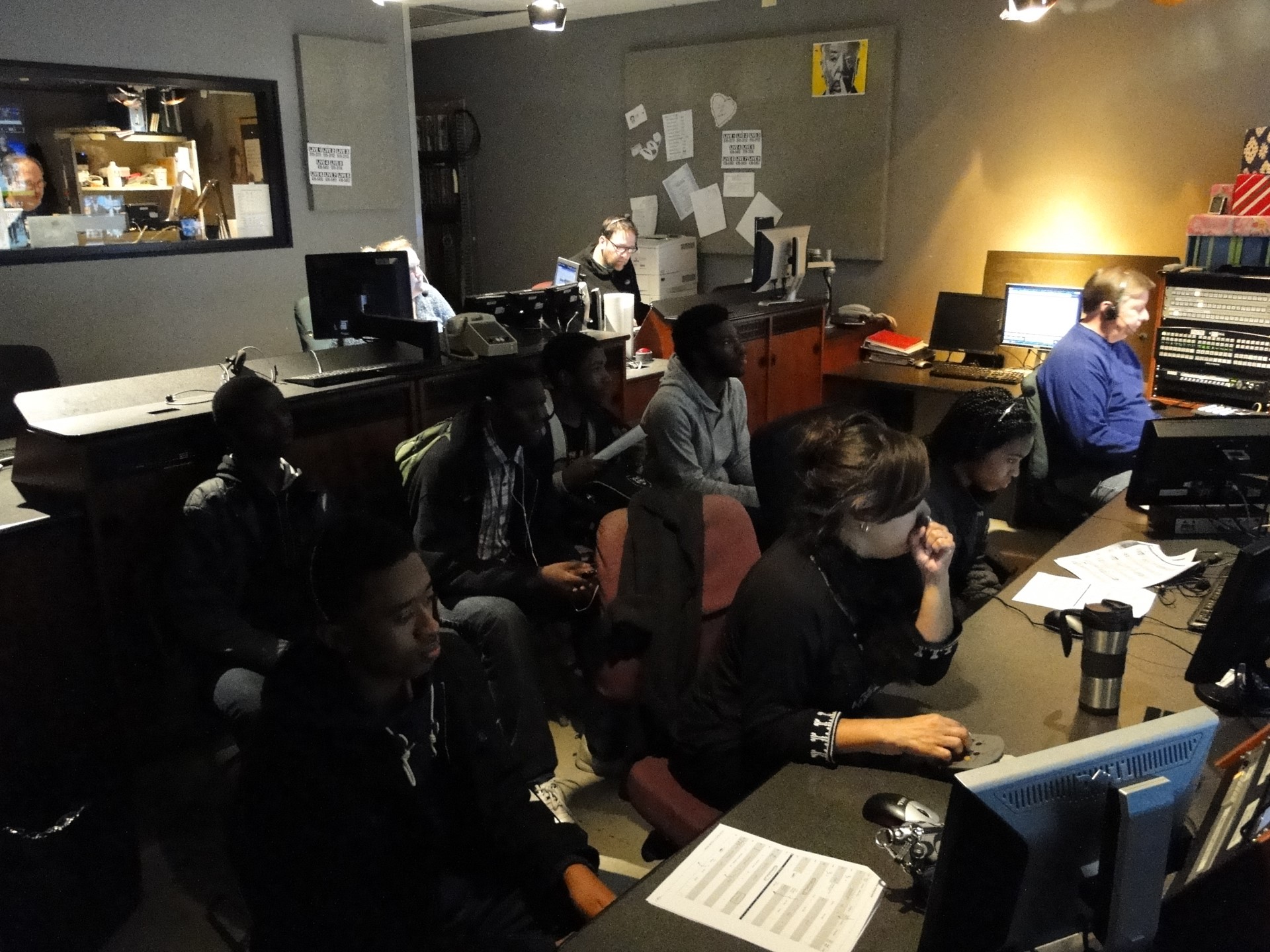 Students observing the action in the control room.