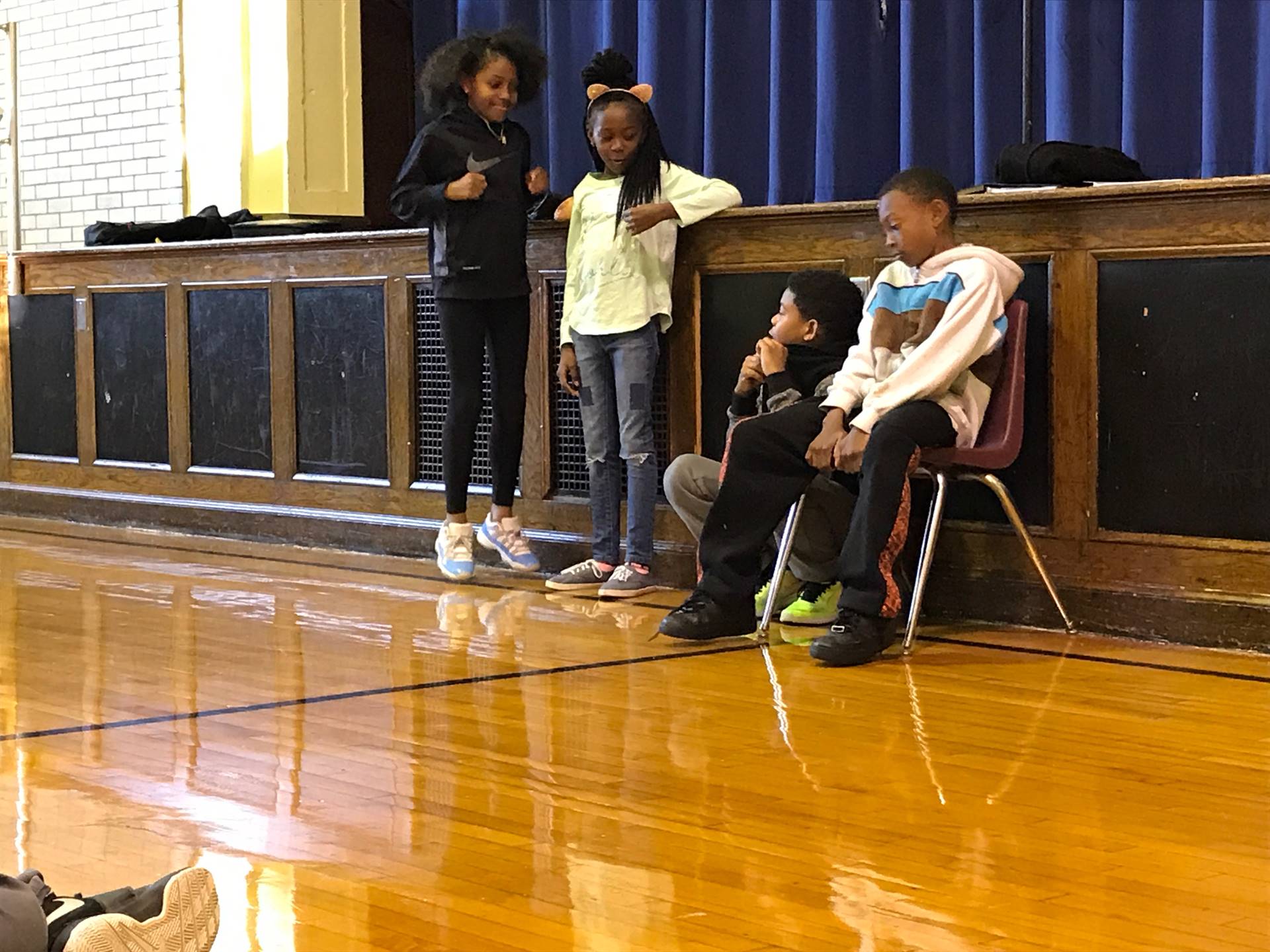 Students perform skits for one another demonstrating the Disney Promises!