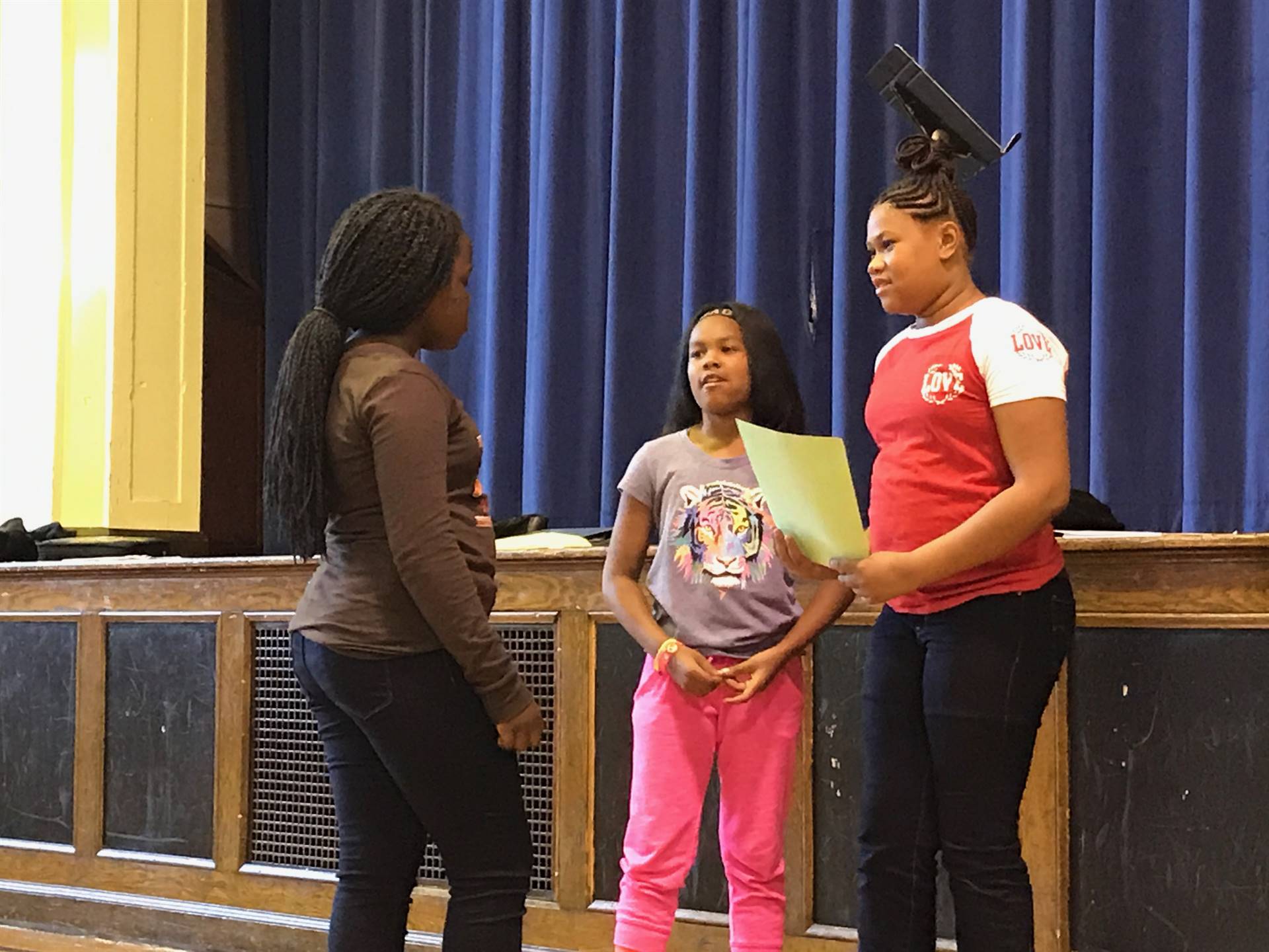 Students perform skits for one another demonstrating the Disney Promises!