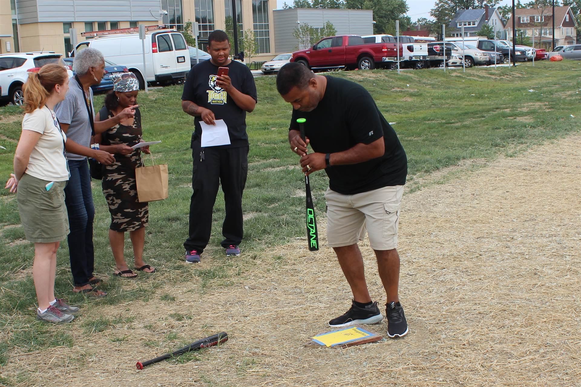 PE teacher Mike Jones expertly executes activity at baseball field.