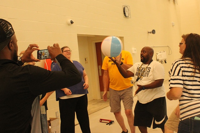 Beach ball volley for 27 hits, on the pool deck.