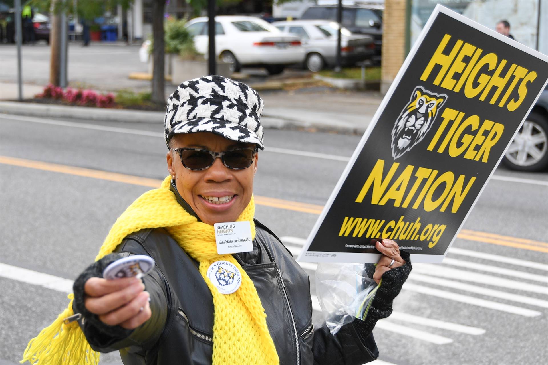 Woman with sign and button