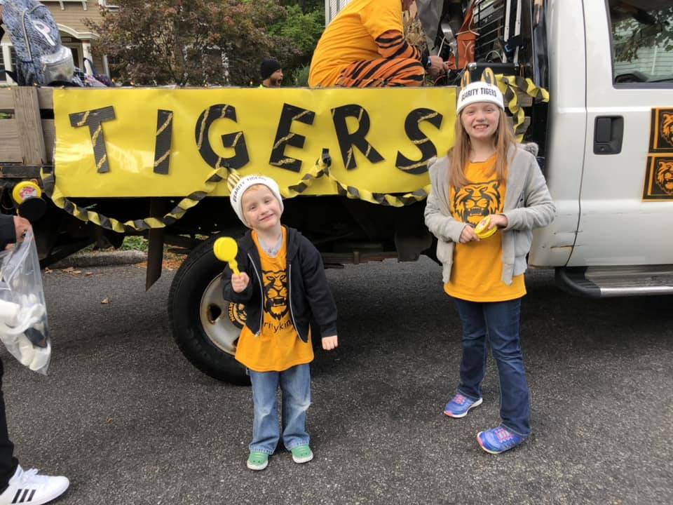 Kids beside truck