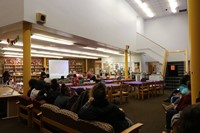 Students sitting in media center watching Skype video