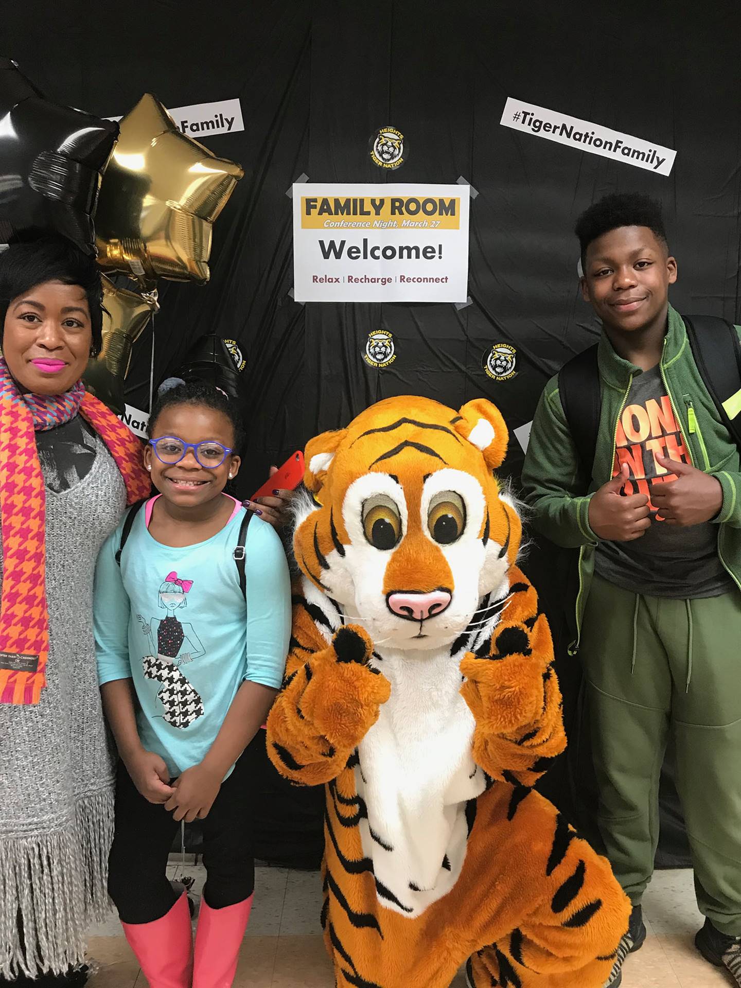 Tiger mascot with HMS family