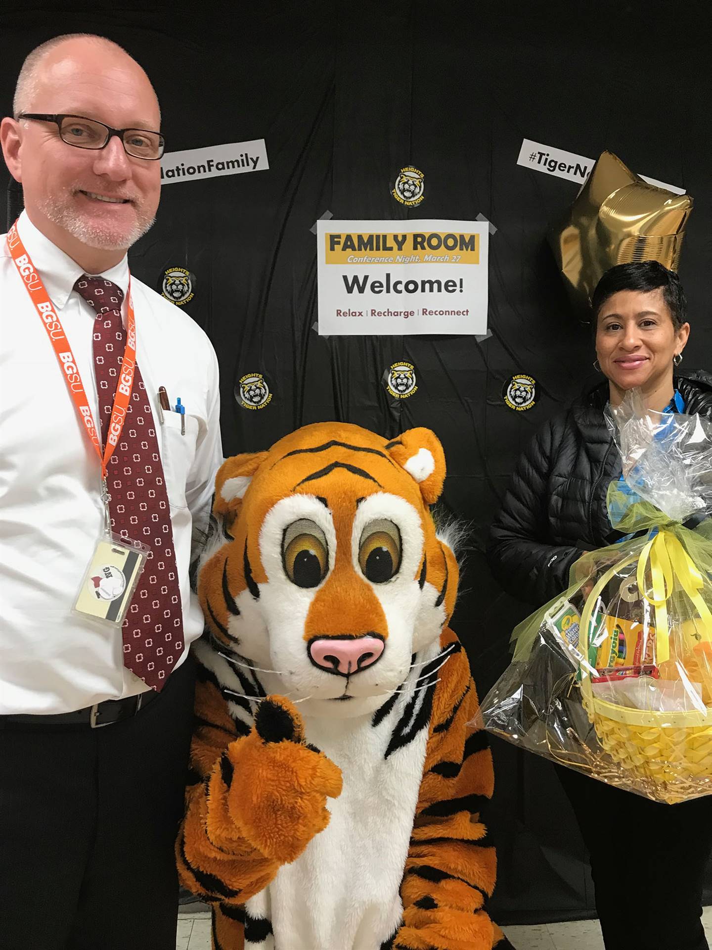 Tiger mascot with Principal Patrick McNichols and parent