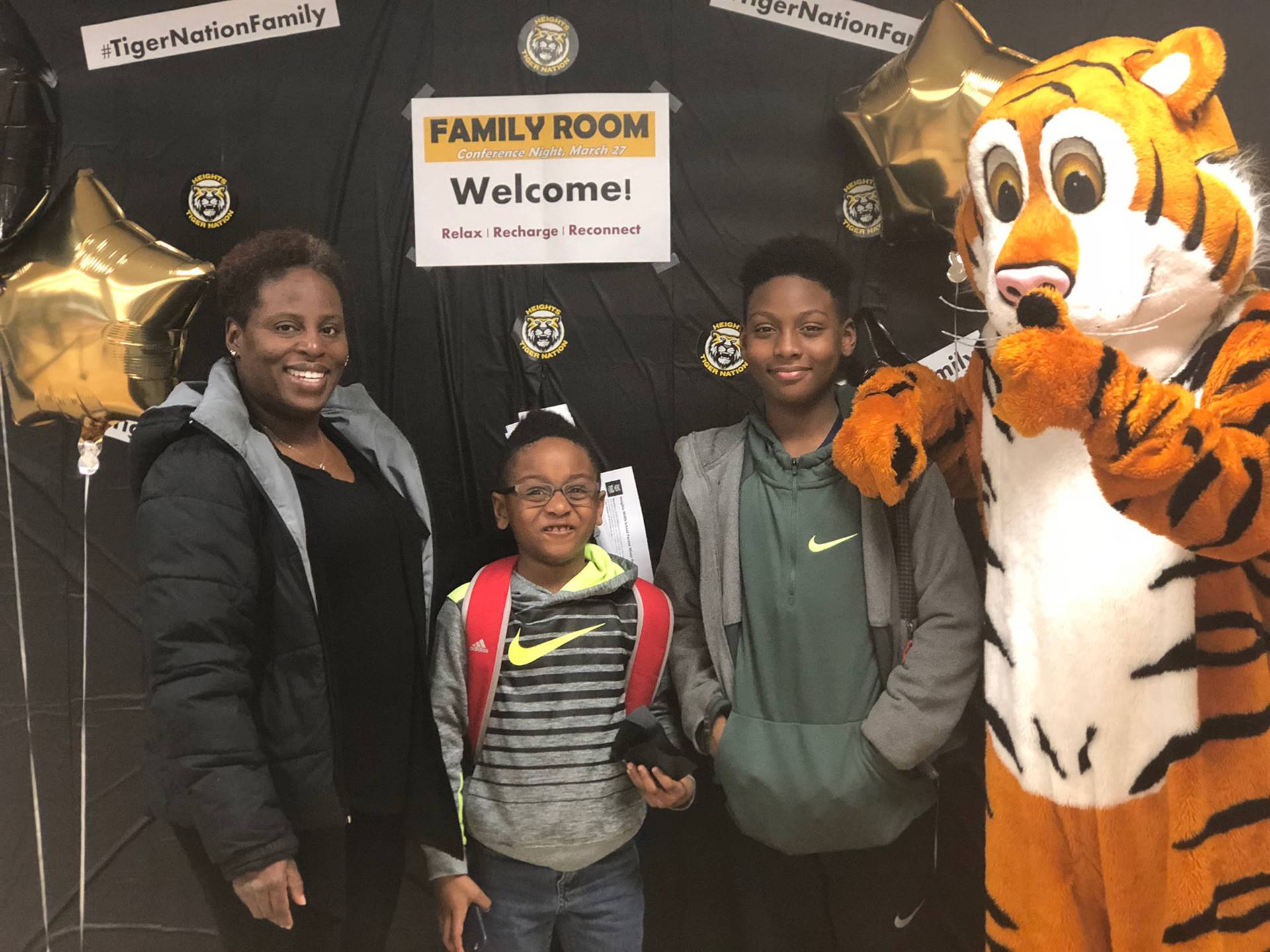 Tiger mascot with HMS family