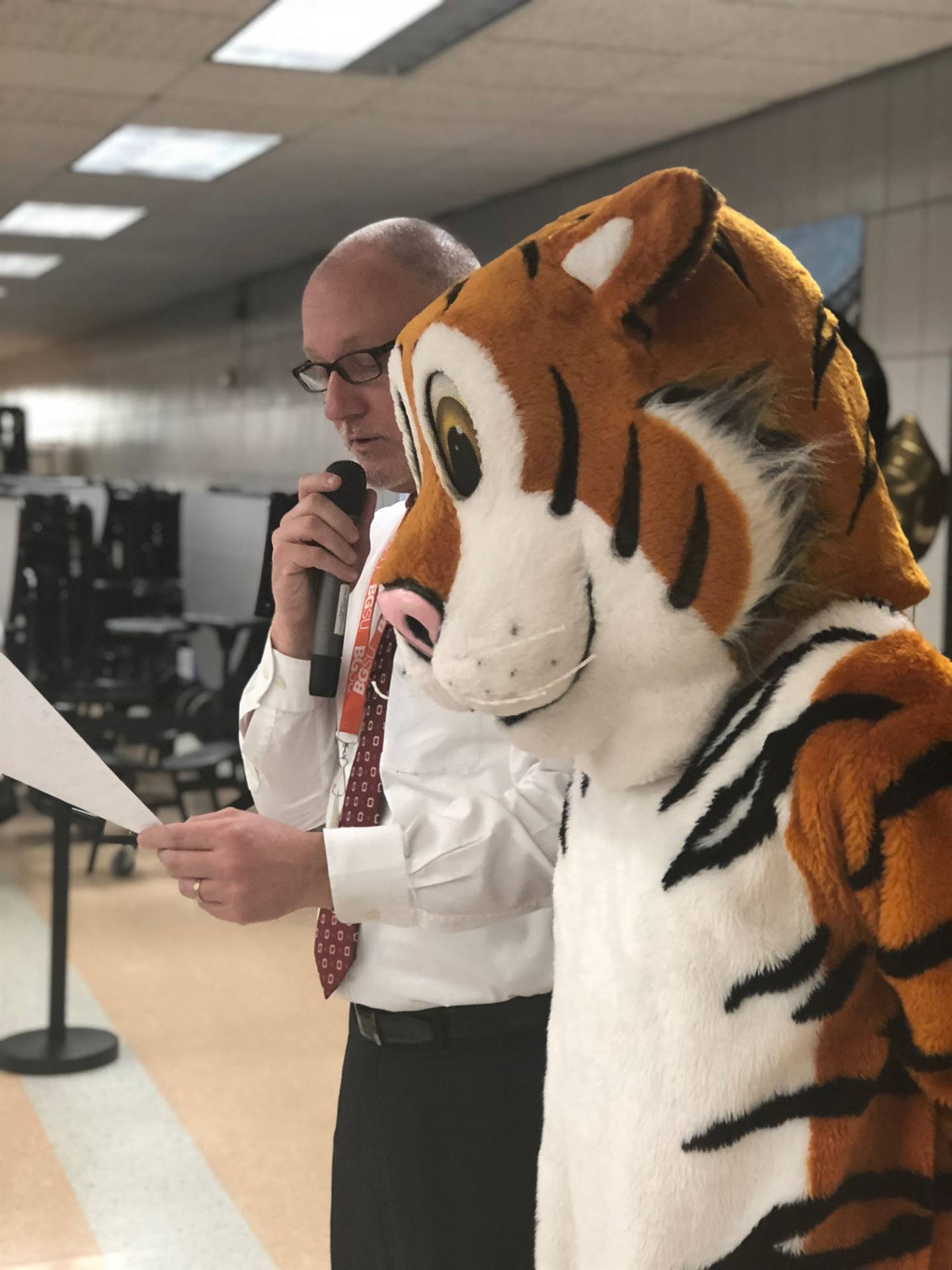Tiger mascot with principal Patrick McNichols