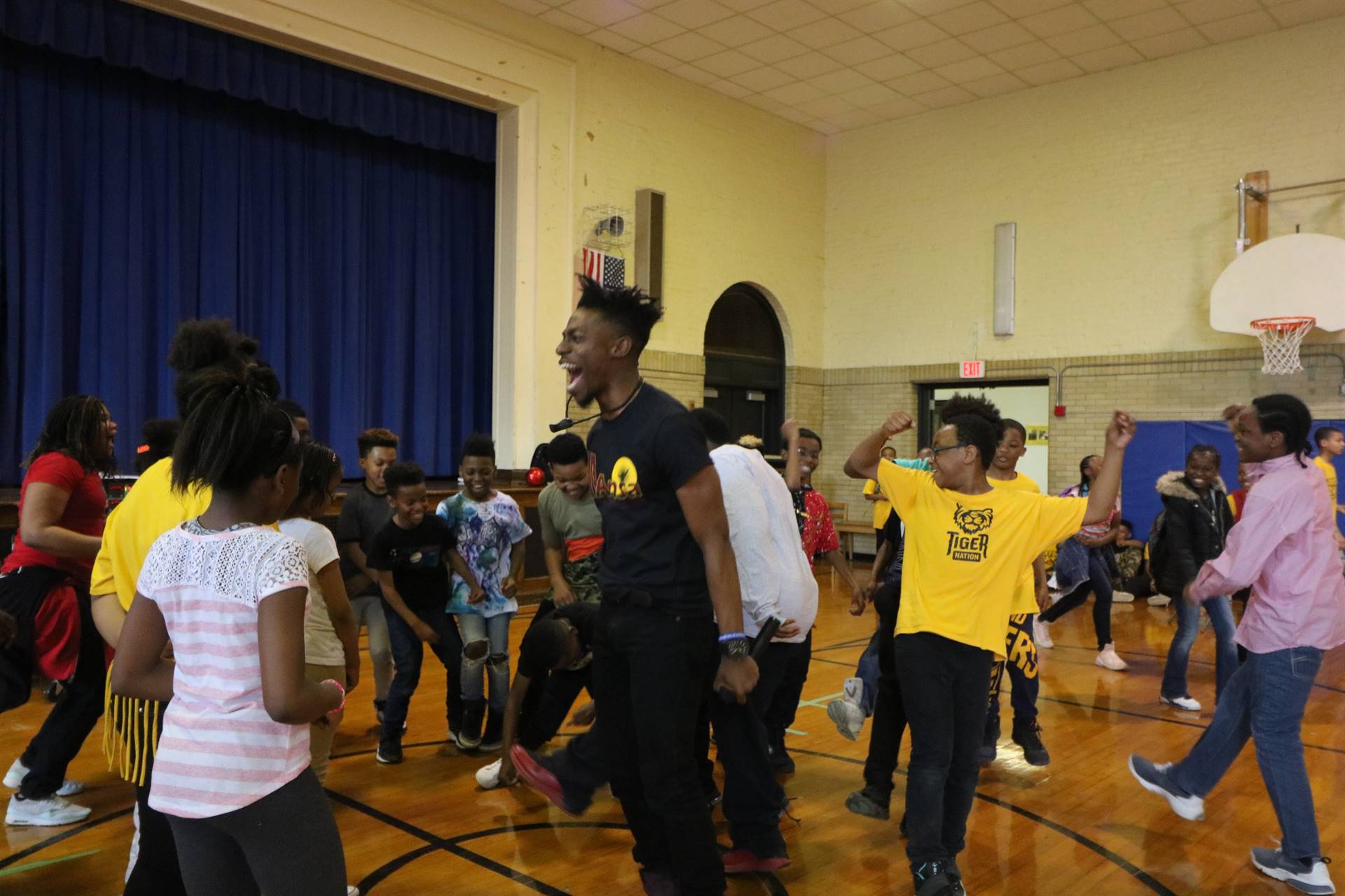 Motivational speaker laughing while dancing