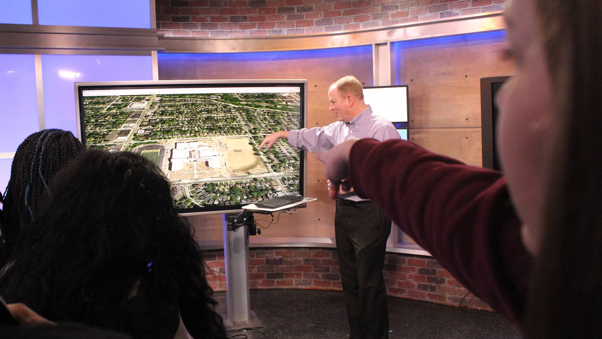 Dan DeRoos demonstrates Google Maps on screen