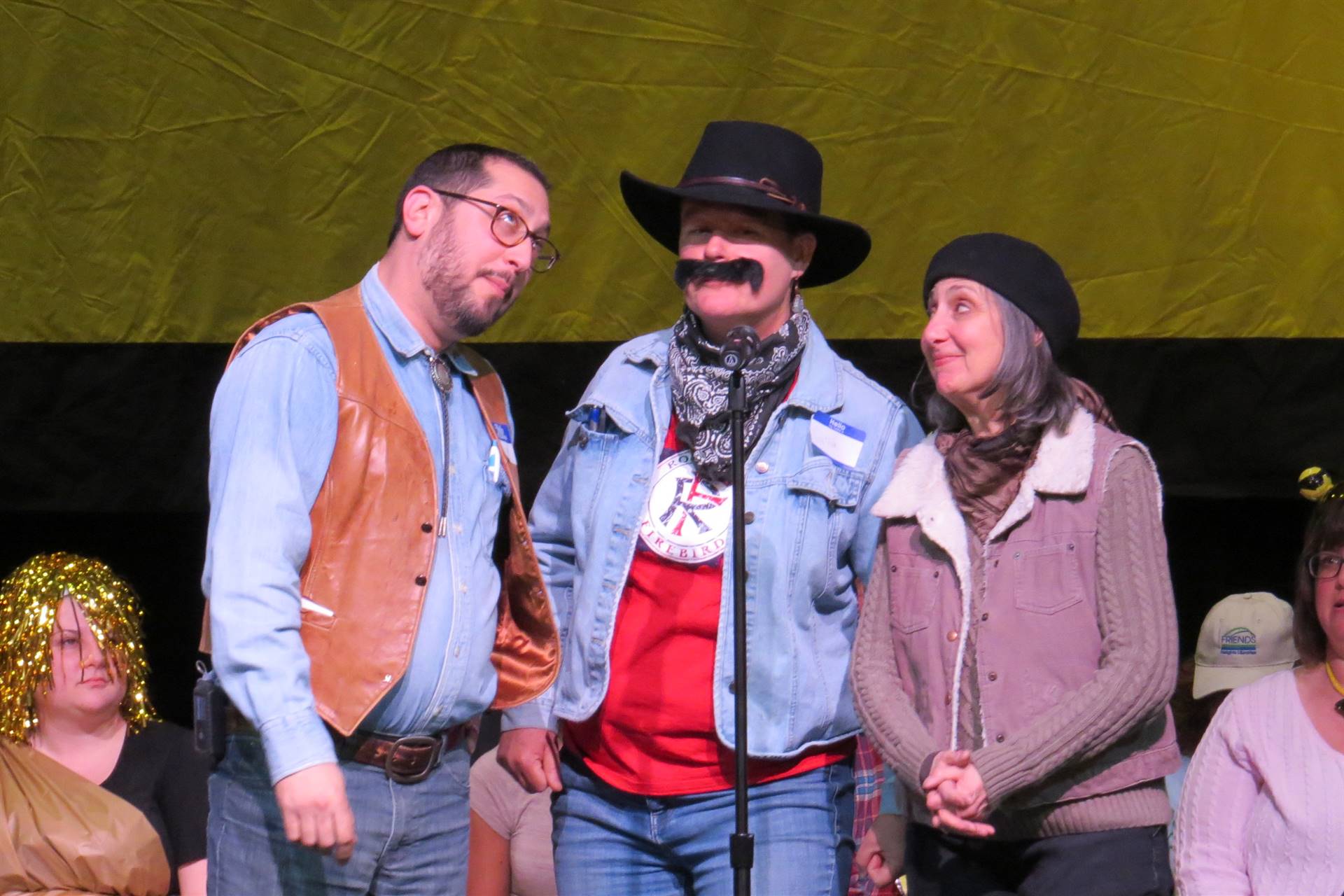 Team on stage in western apparel 