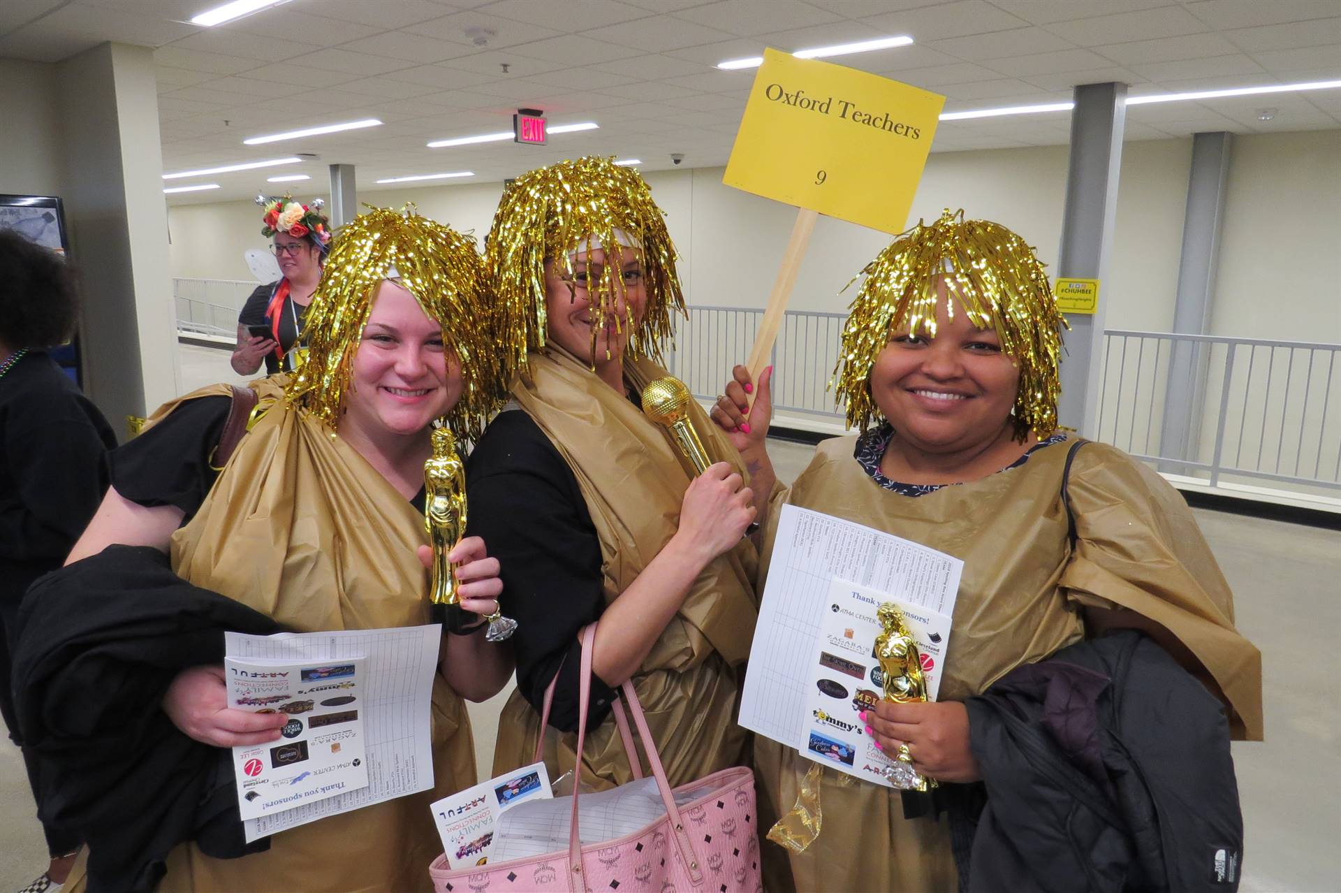 Three females with gold wigs