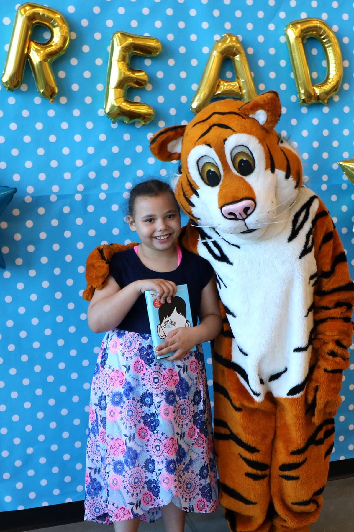 Tiger and girl at CH-UH Family Literacy Night