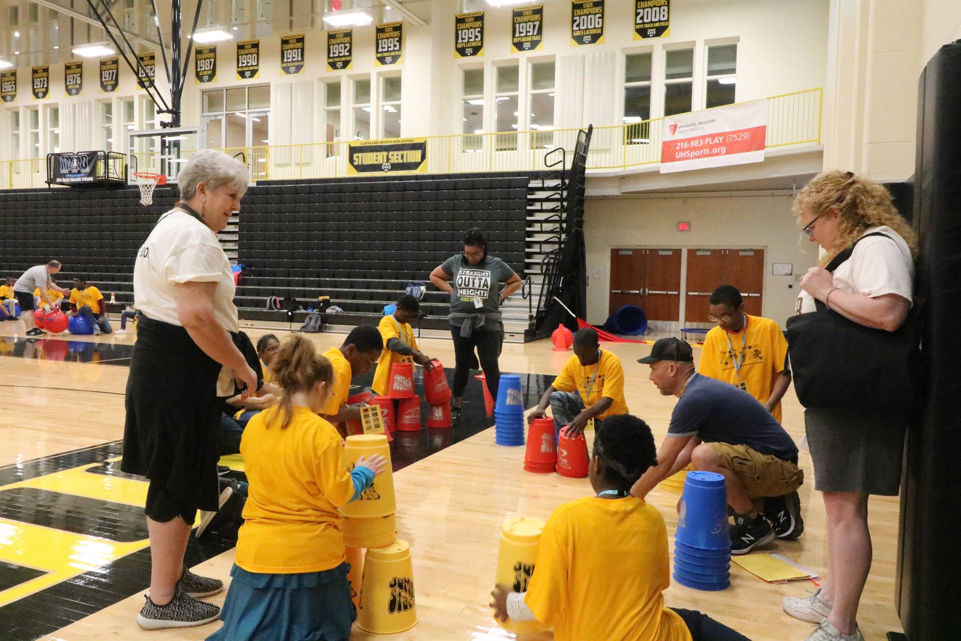 Kids playing cup stacking game