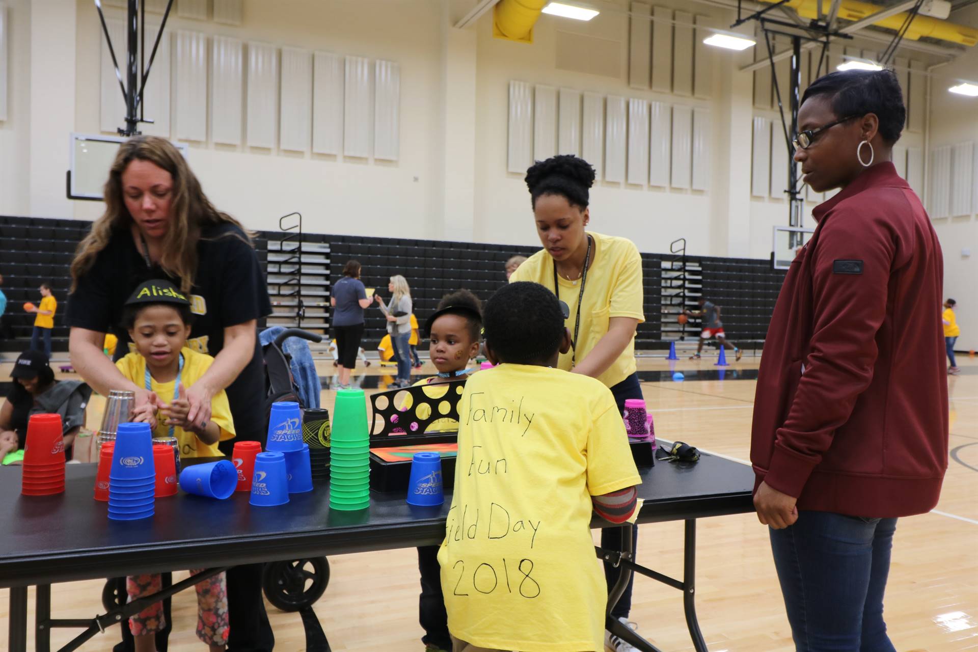 Kids playing cup stacking game at table