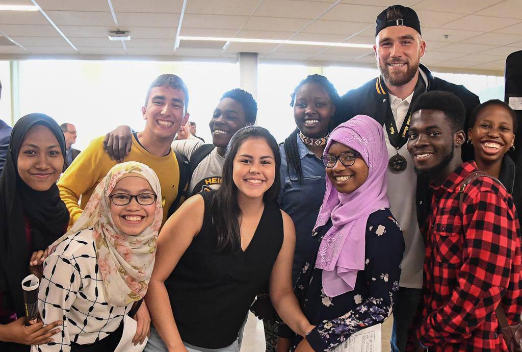 Travis Kelce with Heights High AFS exchange students
