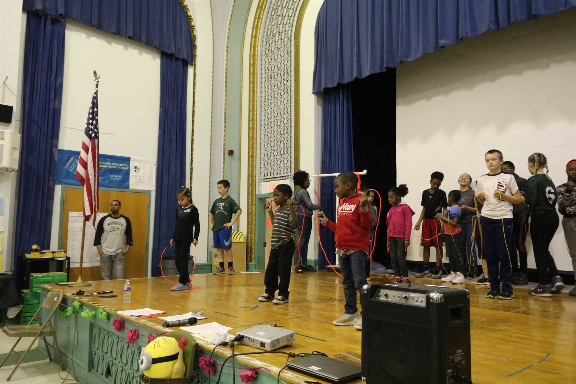 Students on stage jumping rope