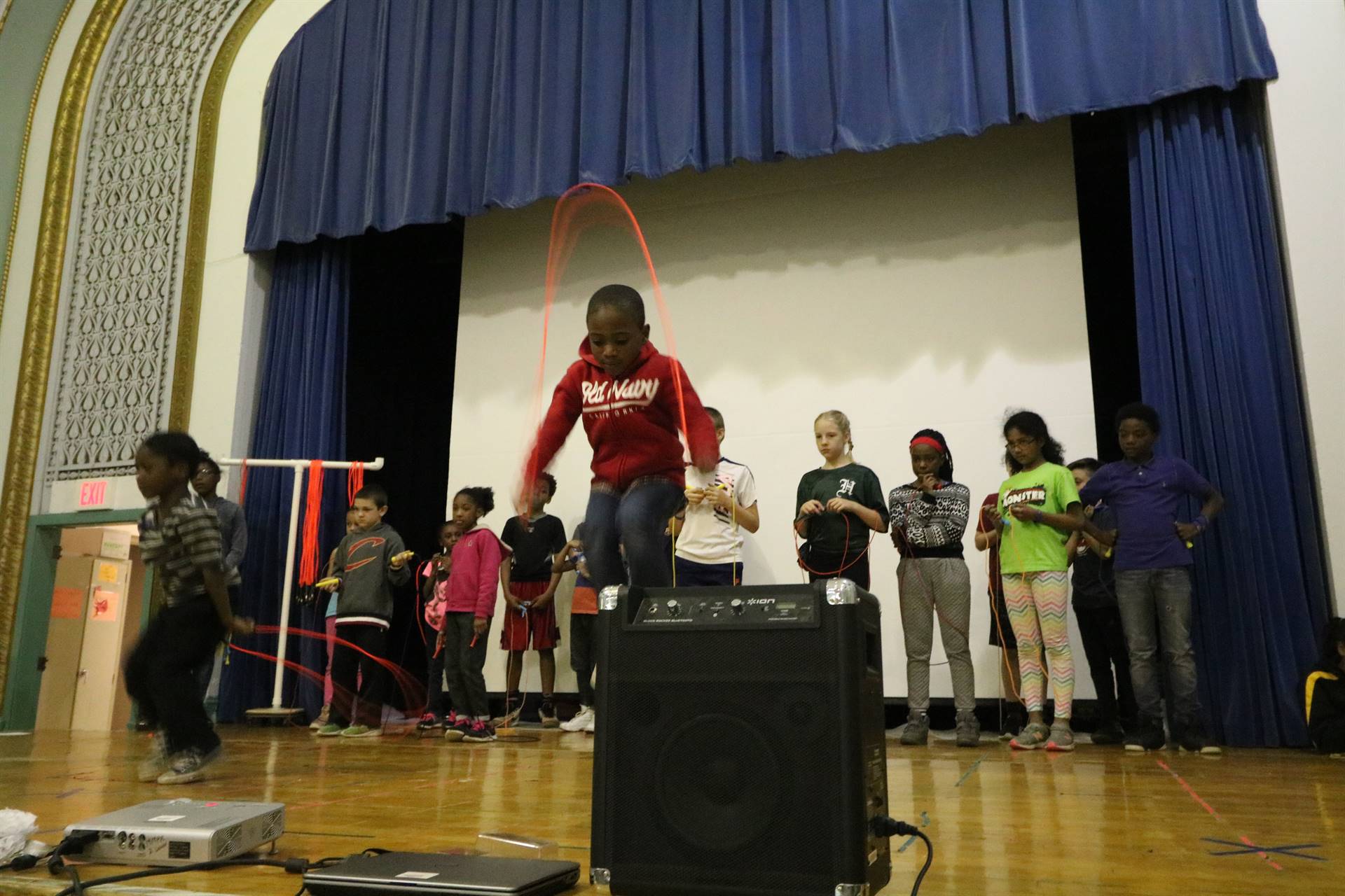 Students on stage jumping rope