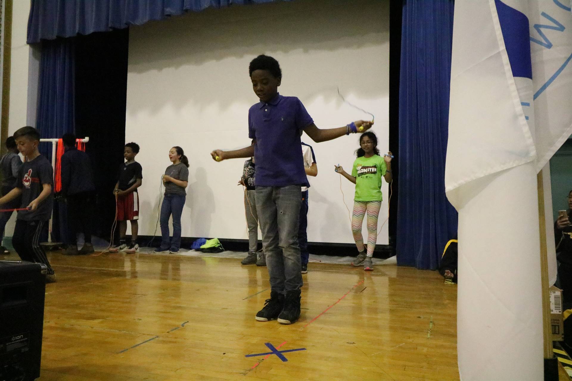 Boy on stage jumping rope