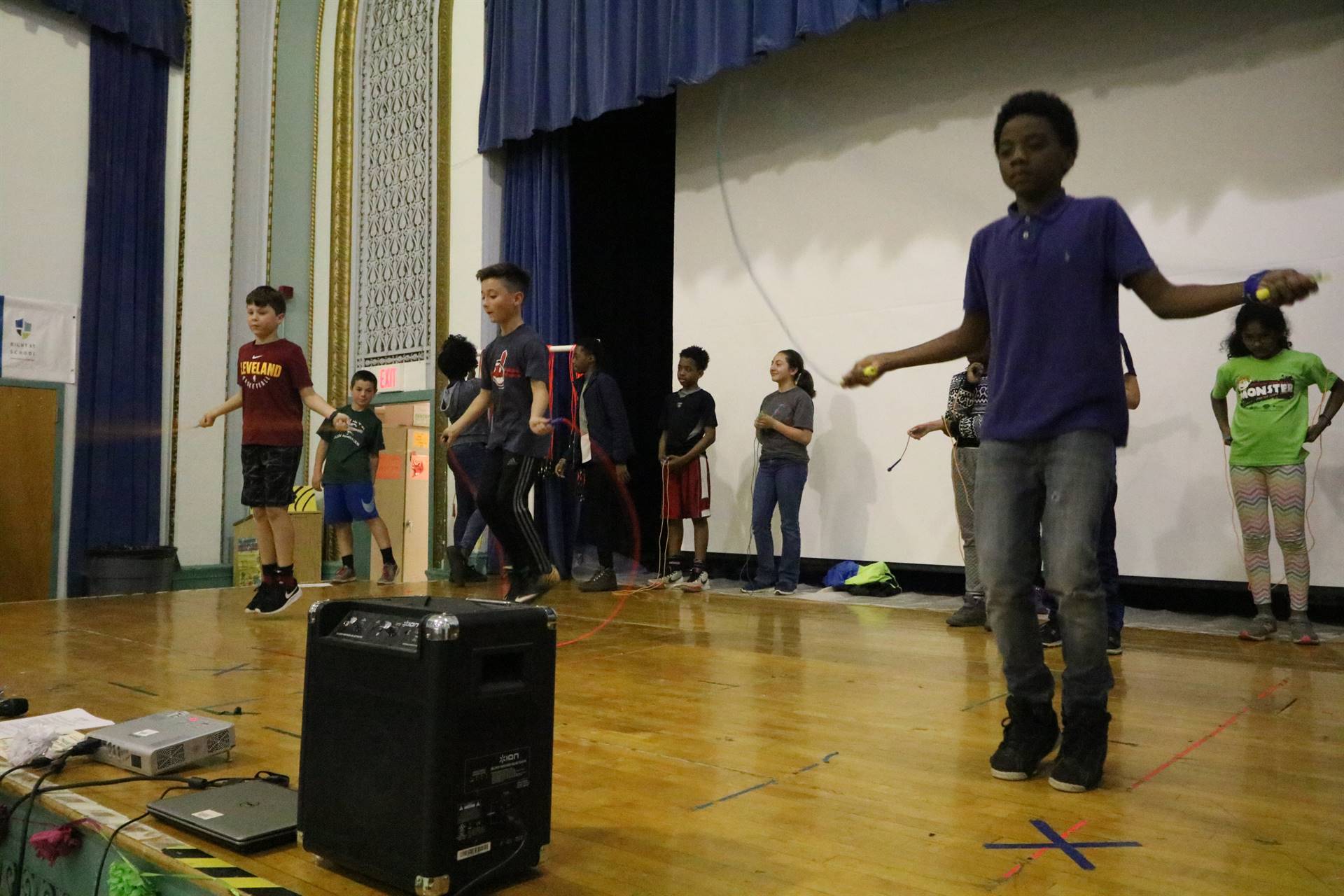 Students on stage jumping rope