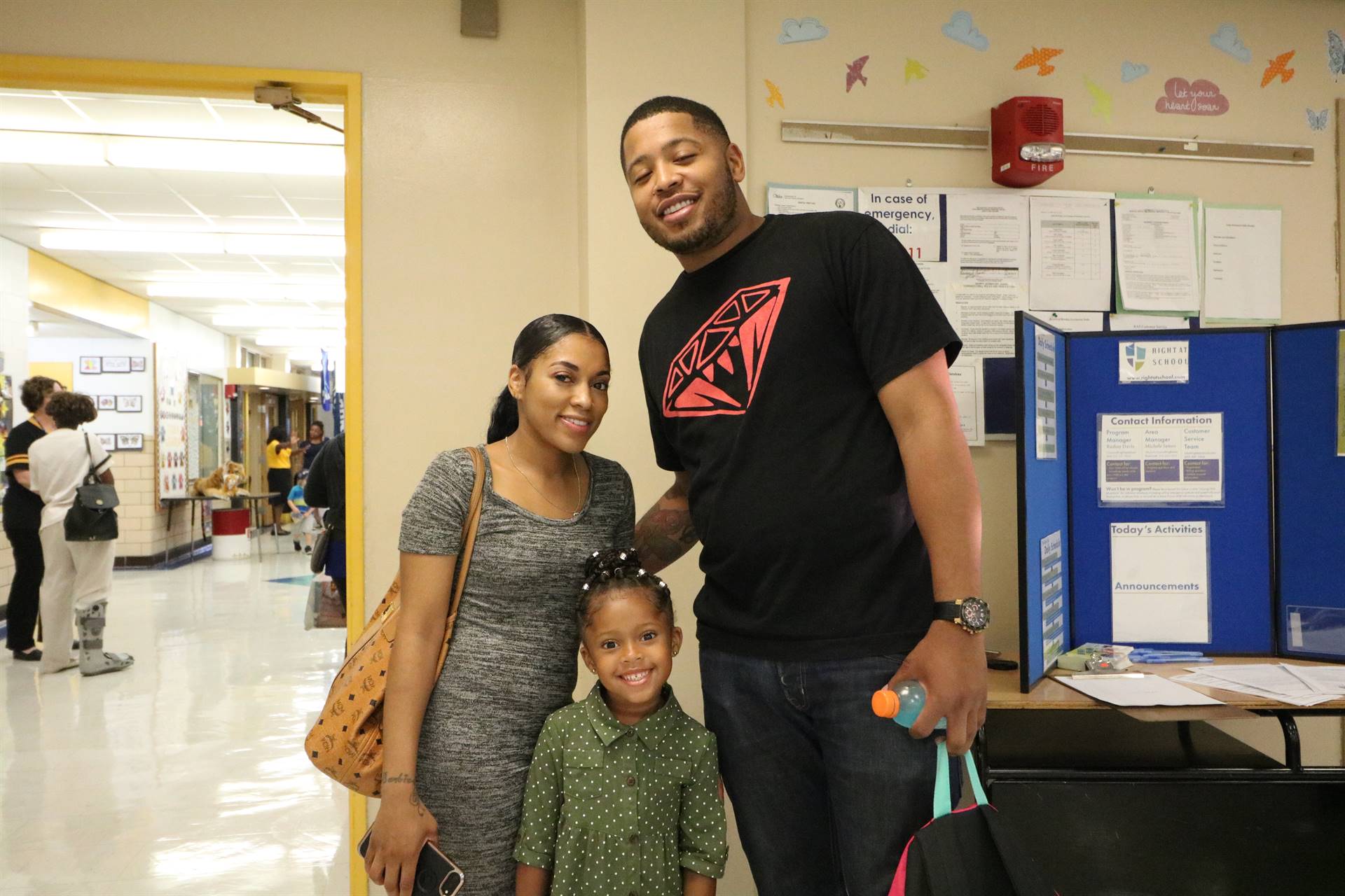 Family of three smiling