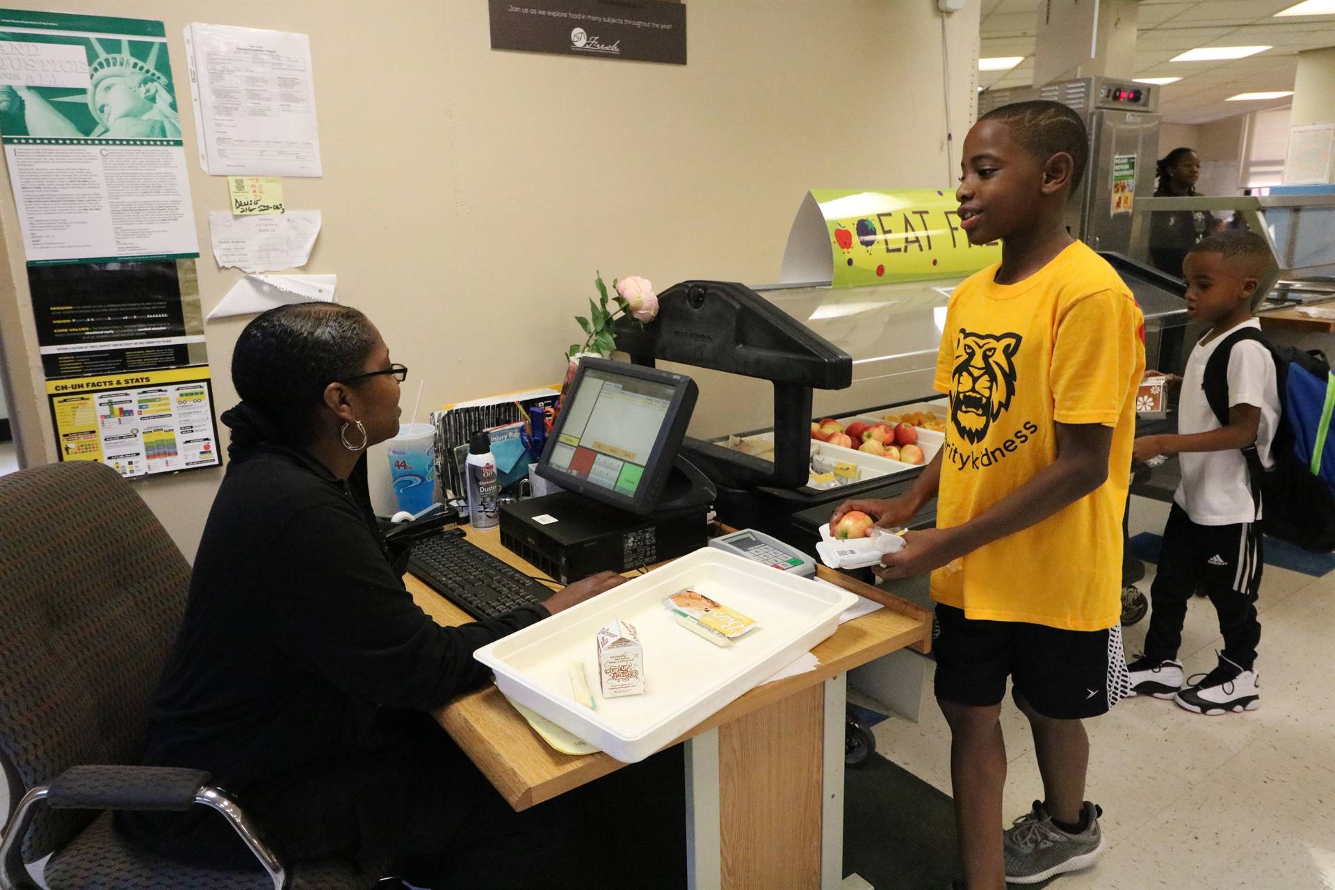 Boy going through breakfast line